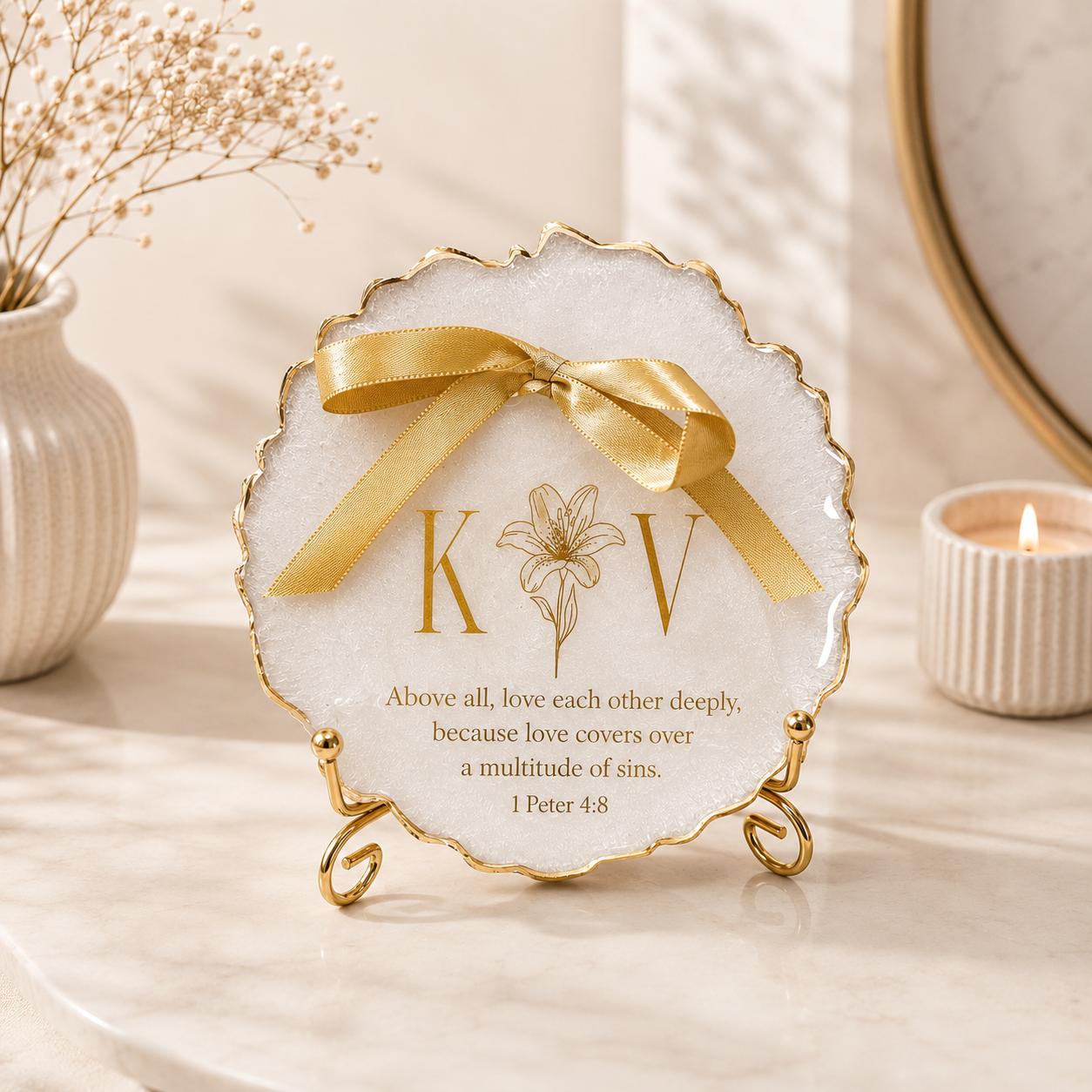 Personalised gold monogram resin wedding keepsake plaque with lily floral detail and Bible verse on gold display stand
